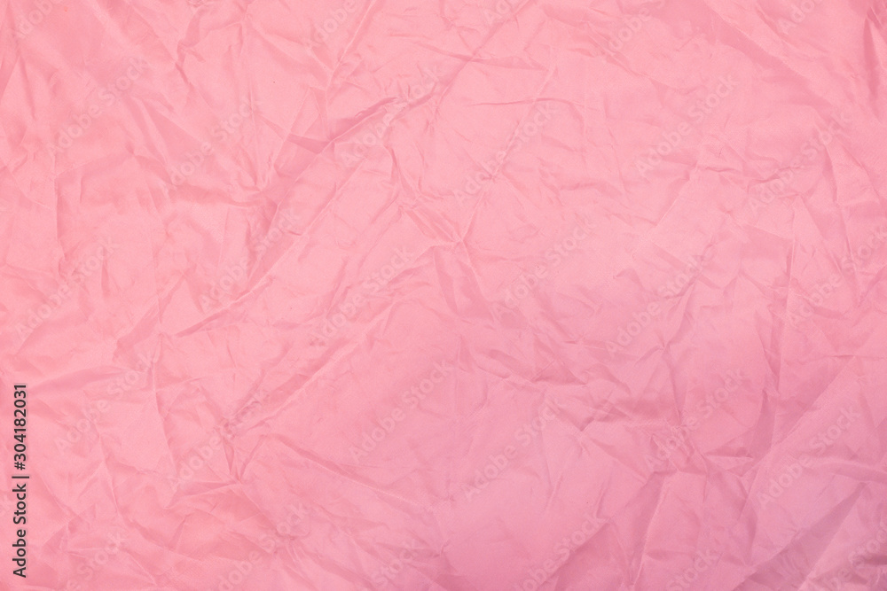 Fototapeta premium pink crumpled background with fabric texture