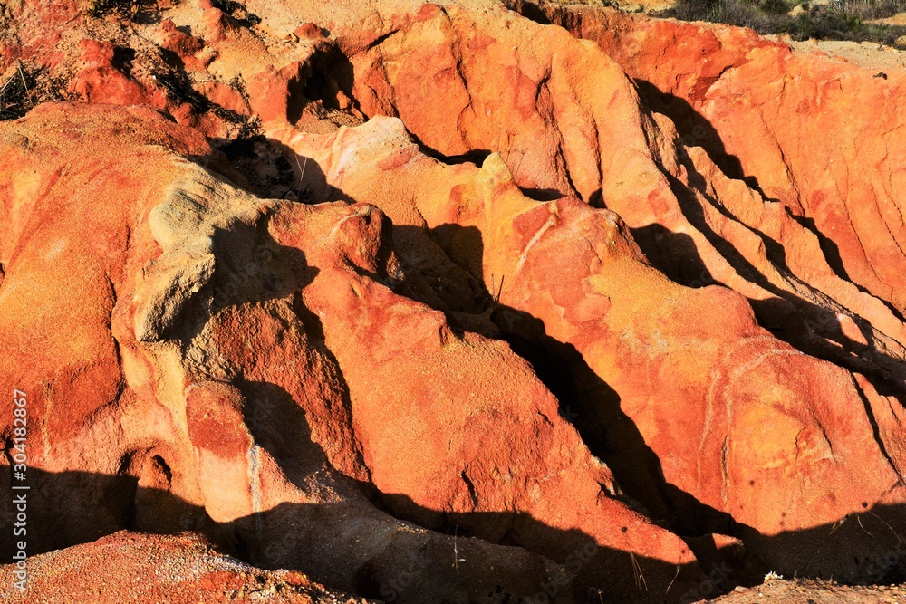 Naklejka premium area with eroded reddish soil