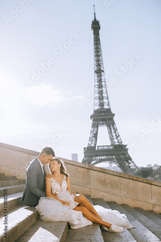 Happy romantic married couple hugging near the Eiffel tower in Paris © jul14ka