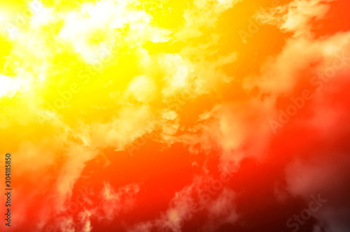 Fiery color sky and sun in clouds. Noise blur. Concept. View from below.