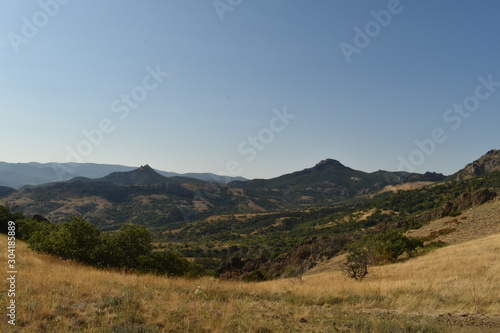 valley landscape with mountains and clouds