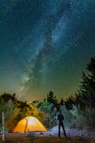 Fototapeta Naklejka Na Ścianę i Meble -  starry night with the Milky Way on the Turkish Mediterranean coast amidst the rocky mountains with tourists in a yellow tent