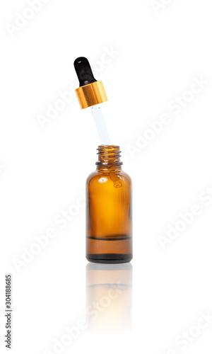 Natural organic oil in brown bottle.
