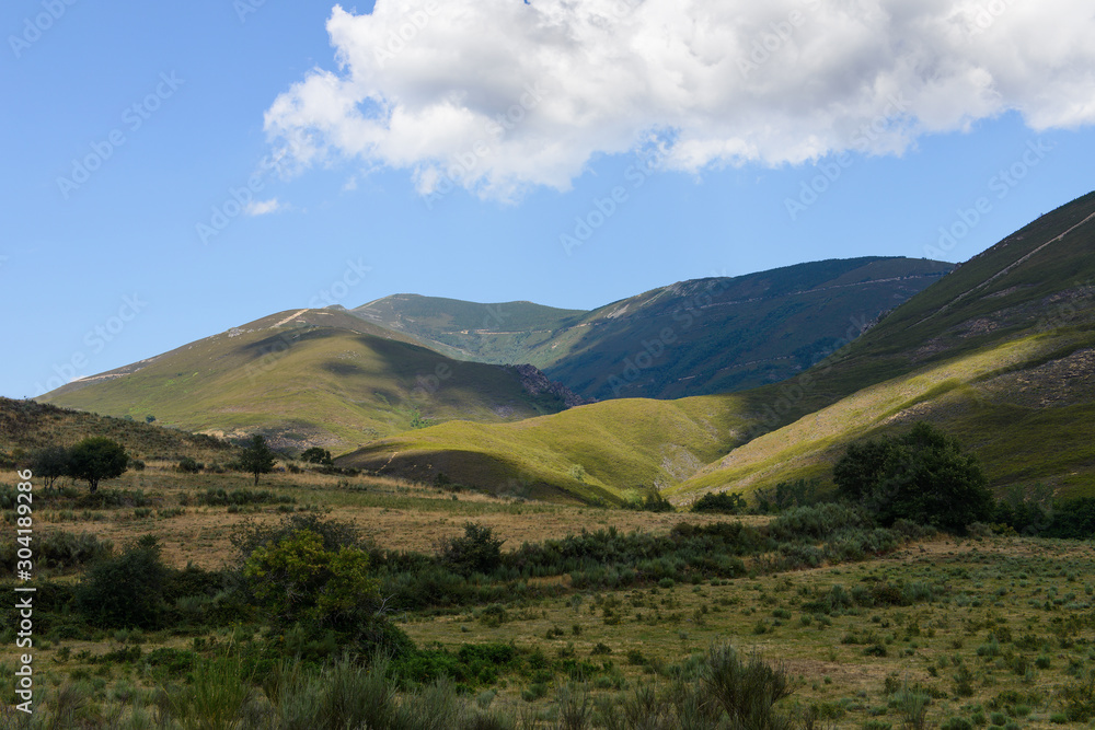 beautiful mountain landscape against a blue cloudy sky in sunny weather