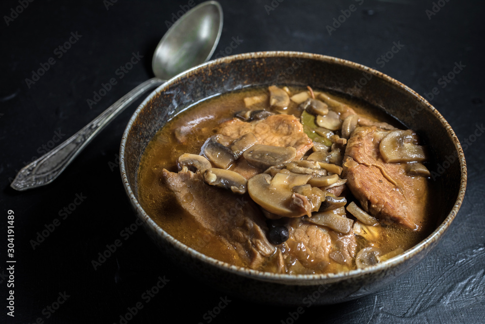Stewed pork chop in a bright mushroom sauce. Stewed pork chop in a bright mushroom sauce.