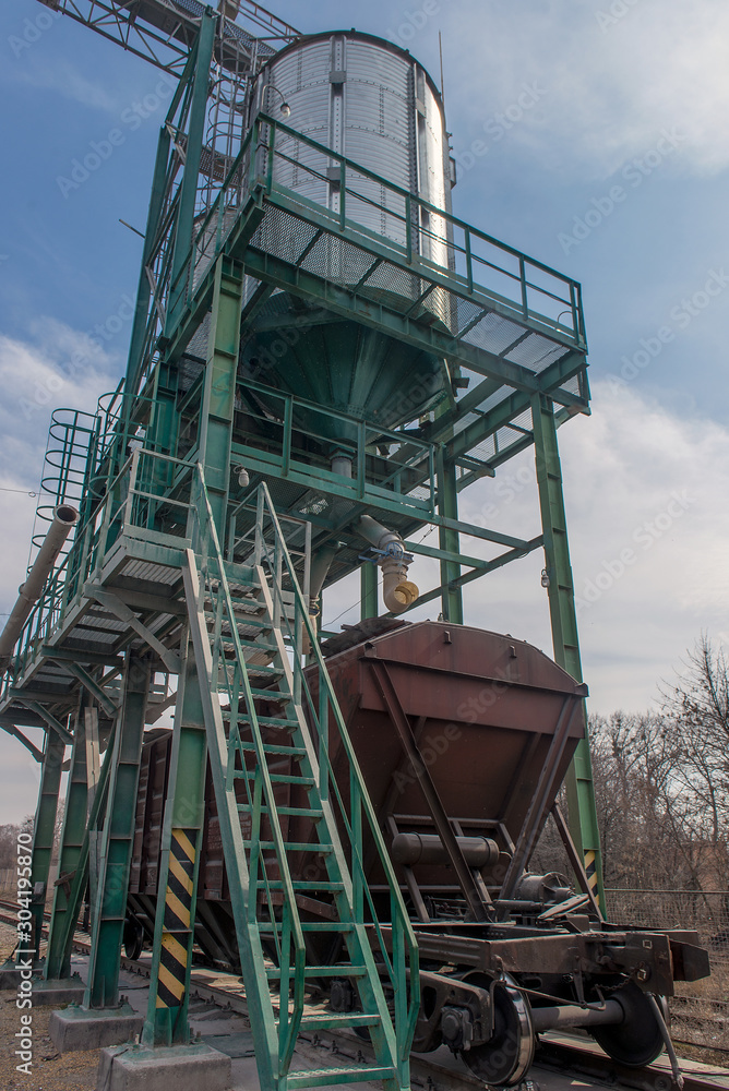 loading grain into the wagons at the elevator loading grain into the wagons at the elevator