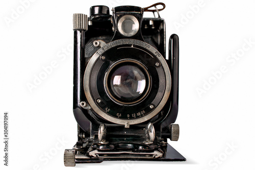 Old black camera on white background, isolated.