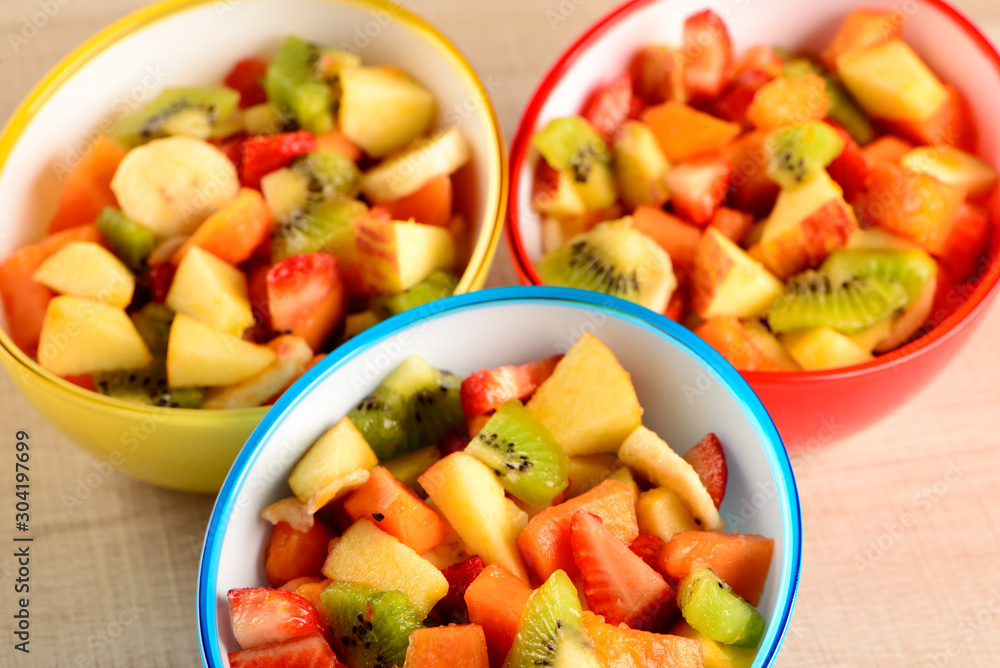 fruit salad in colorful bowls fruit salad in colorful bowls
