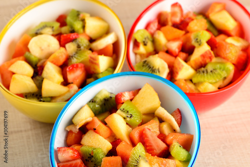 fruit salad in colorful bowls
