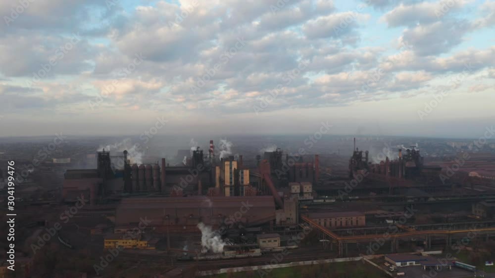 Aerial view. Emission to atmosphere from industrial pipes. Smokestack pipes shooted with drone. Aerial view. Emission to atmosphere from industrial pipes. Smokestack pipes shooted with drone.