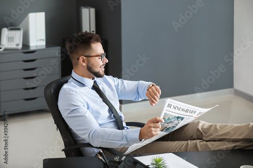 Handsome businessman lookin...
