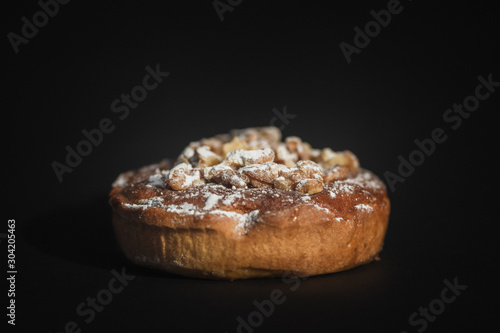 walnut cake on dark background