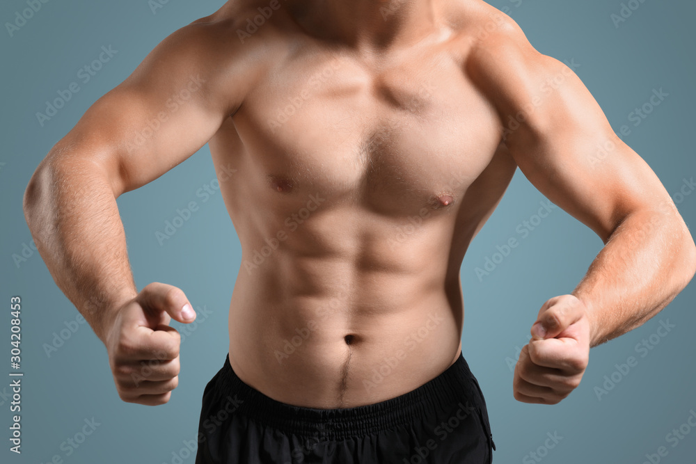 Fototapeta premium Handsome male bodybuilder on grey background