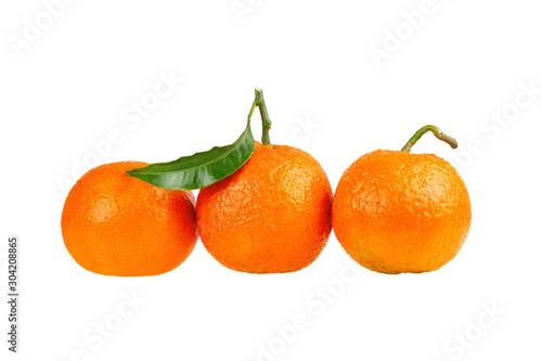 three tangerine mandarin orange fruit isolated on white