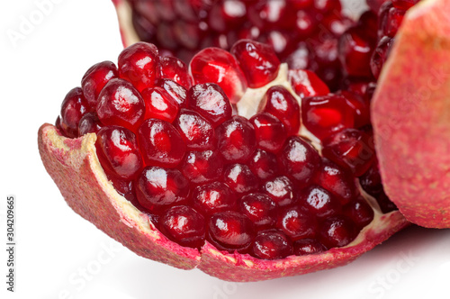 closeup pomegranate slice with ripe grains