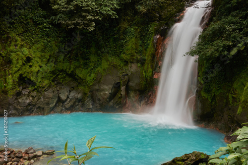 Fototapeta Naklejka Na Ścianę i Meble -  Waterfall of the Celeste River in Tenorio Volcano National Park, Costa Rica