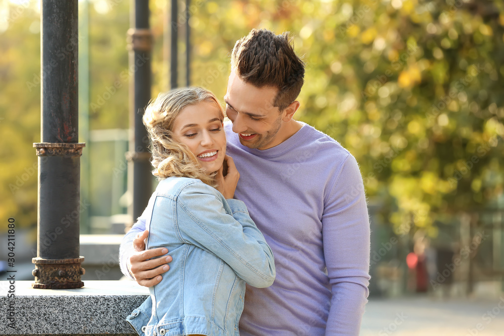 Happy young couple on romantic date in park Happy young couple on romantic date in park