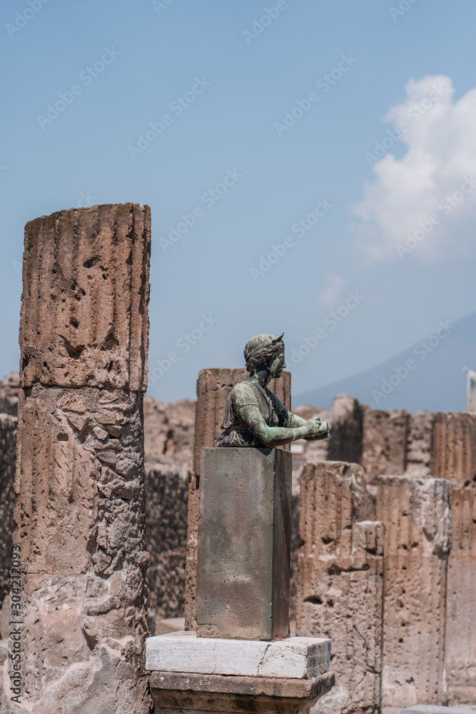 Statue in Pompei archaelogical ruins during summer time