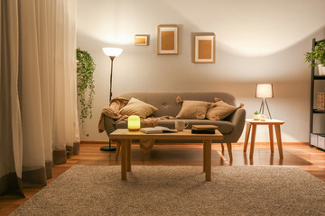 Stylish interior of living room at night