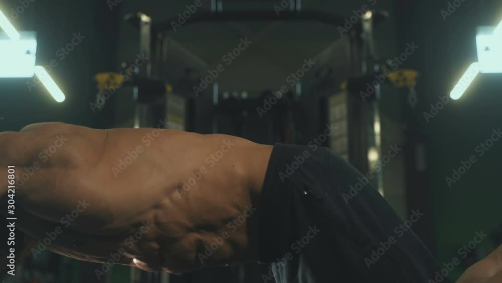 Handsome strong athletic men pumping up muscles workout fitness and bodybuilding concept background - muscular bodybuilder fitness men doing abs exercises in gym naked torso