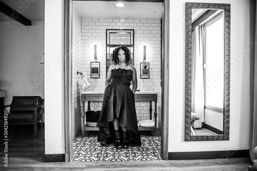 Woman posing in high low dress with pockets