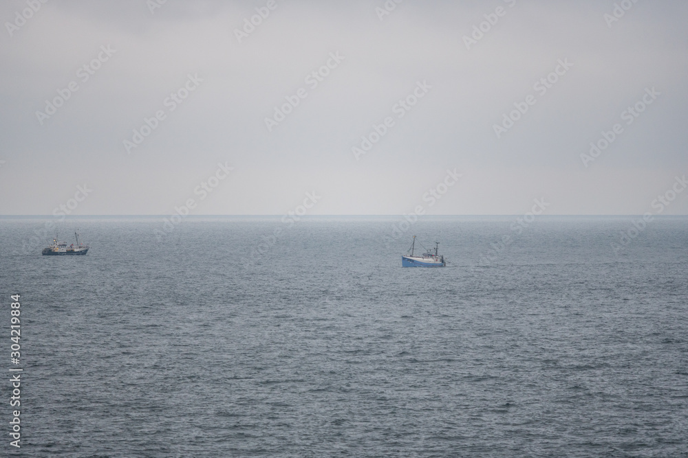 Fishing boats fishing  for delicious fish on the North Sea