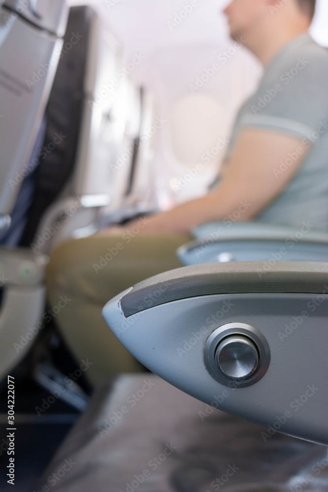 Close Up of Armrest inside an Airplane during Flight Close Up of Armrest inside an Airplane during Flight