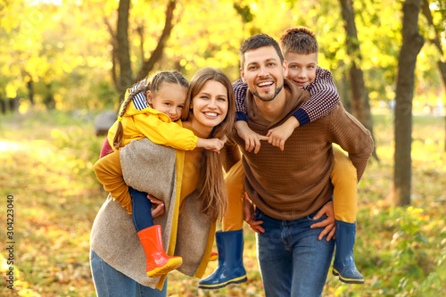 Happy family resting in aut...
