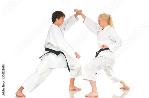 Blonde girl and a young impudent karate guy