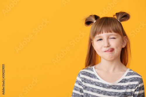 Cute little girl on color b...