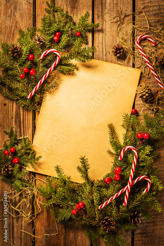 Christmas background - vintage sheet of paper on wood