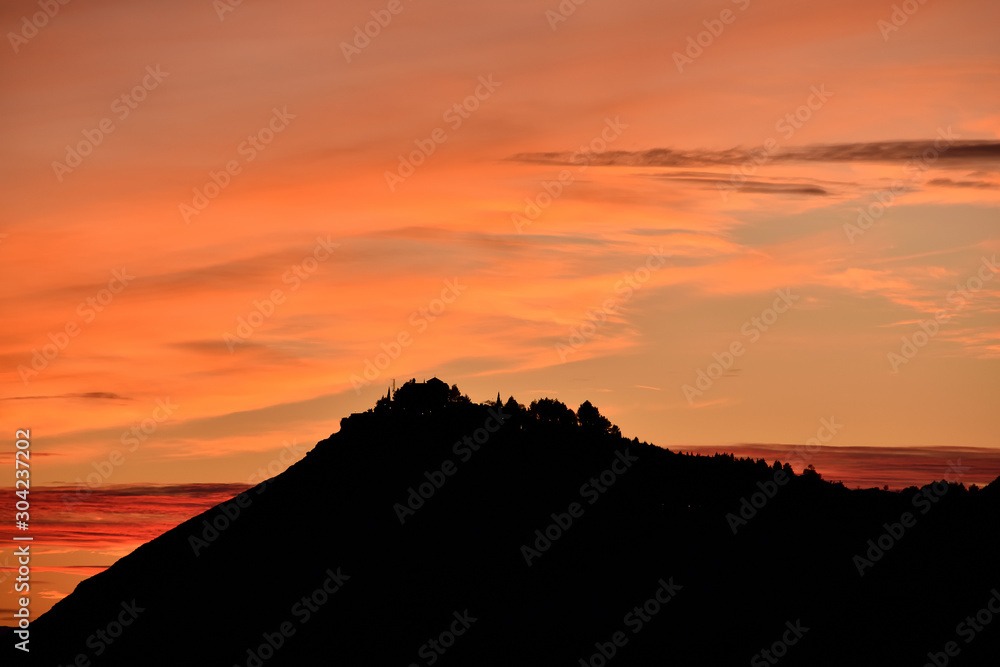 Sunset with different tones and clouds over Sierra Elvira in Granada Sunset with different tones and clouds over Sierra Elvira in Granada