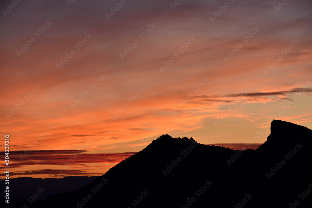 Sunset with different tones and clouds over Sierra Elvira in Granada