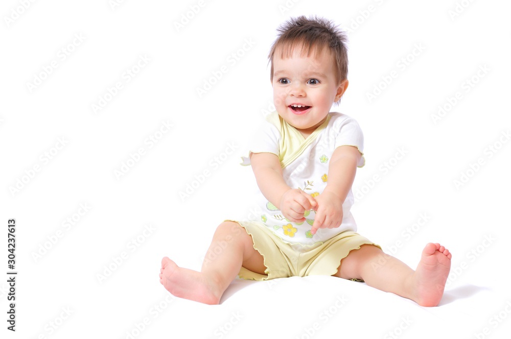 Sitting baby girl in child wear fun Sitting baby girl in child wear fun