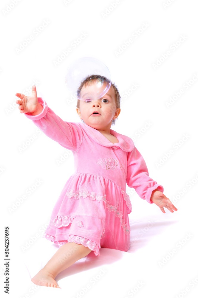 Funny little girl plays with soap bubbles Funny little girl plays with soap bubbles