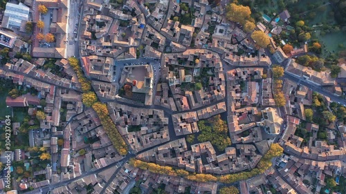 Vertical aerial view over Uzès south of France Gard beautiful village sunrise historical city center  photo