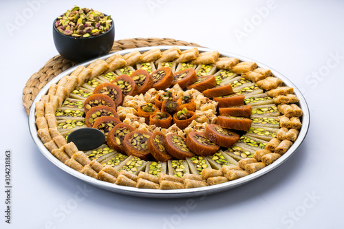 assorted mixed oriental dessert made with konafa and baklava
