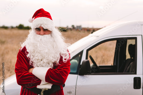 Santa Claus working as a delivery man at christmas