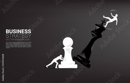 Silhouette of businessman push pawn chess piece to checkmate the king with falling down businessman. concept of business strategy and marketing plan disruption