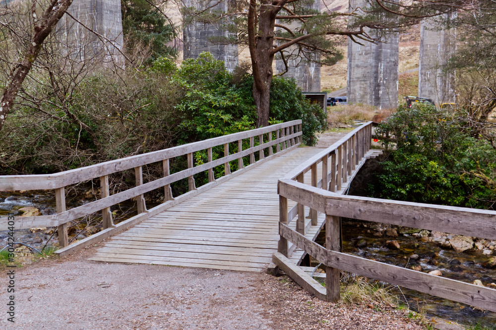Wooden bridge in the park Glenfinnan Scotland Highlands Wooden bridge in the park Glenfinnan Scotland Highlands