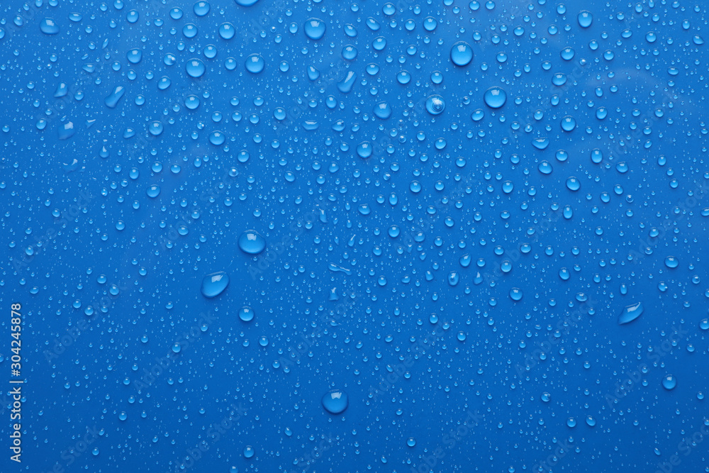 Water drops on blue background, top view - obrazy, fototapety, plakaty 