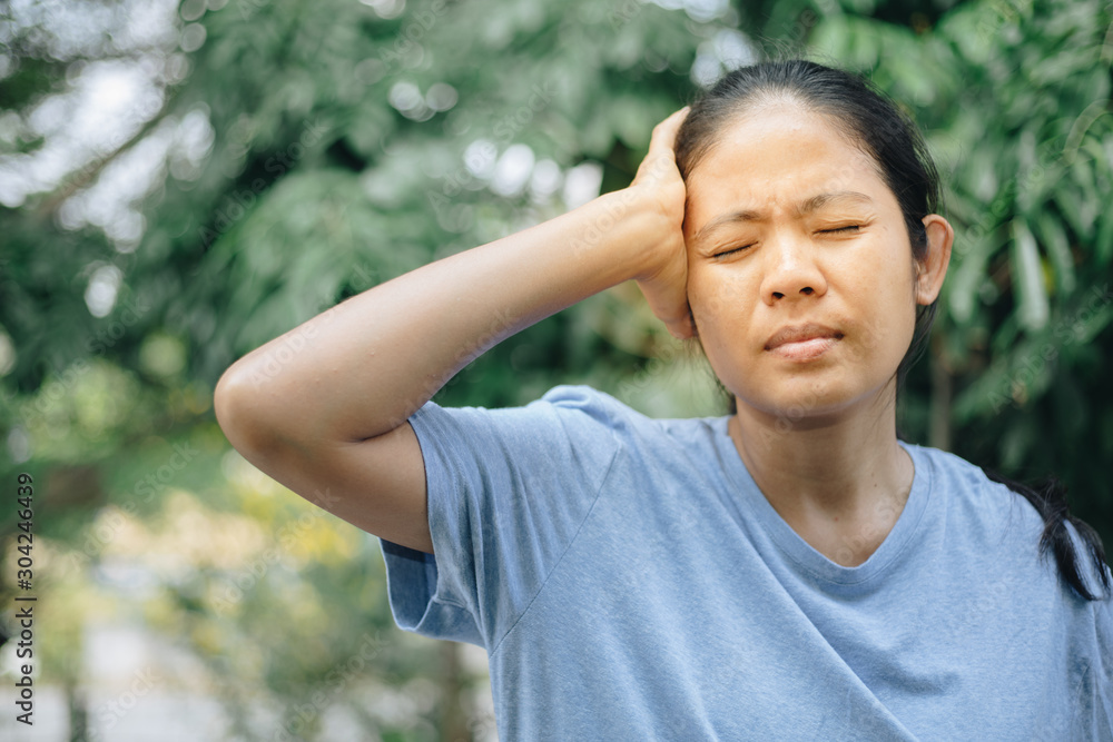 Young asian Woman having headache and strain Young asian Woman having headache and strain