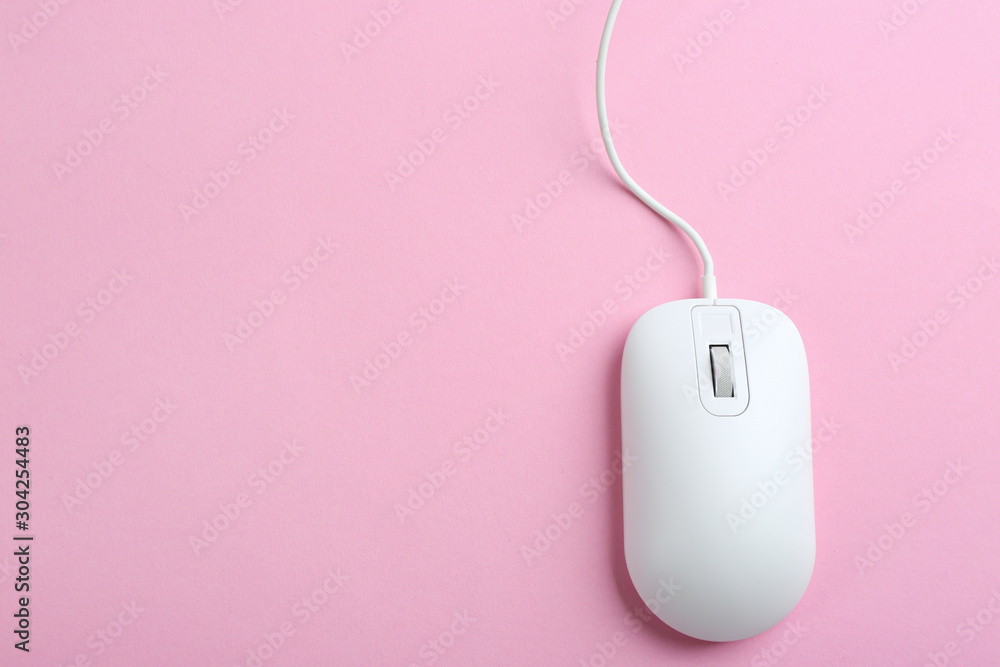 Modern wired optical mouse on pink background, top view. Space for text Modern wired optical mouse on pink background, top view. Space for text
