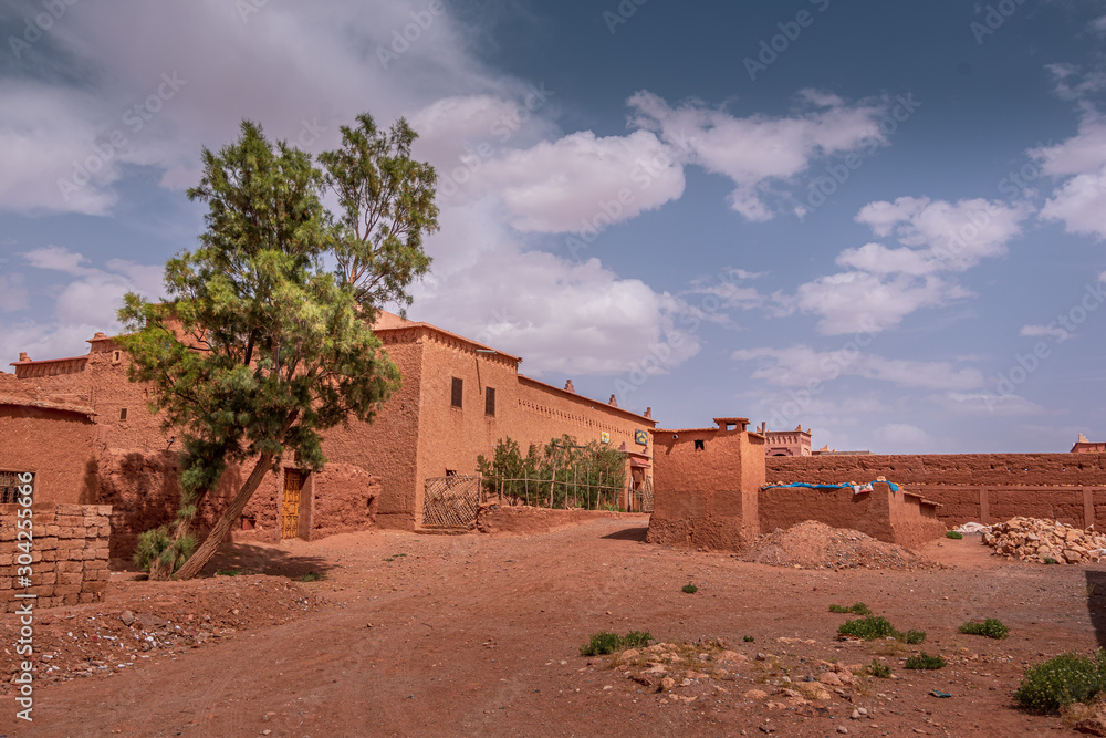 Landscape view of Ait-Ben Haddou village, entrance to the desert. Sunny day in Ouarzazate, Morocco. Landscape view of Ait-Ben Haddou village, entrance to the desert. Sunny day in Ouarzazate, Morocco.