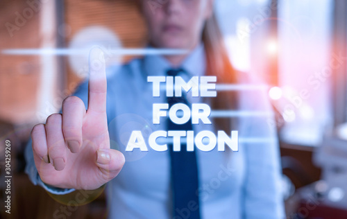 Word writing text Time For Action. Business photo showcasing getting ready to start doing encouragement Go fast Blurred woman in the background pointing with finger in empty space