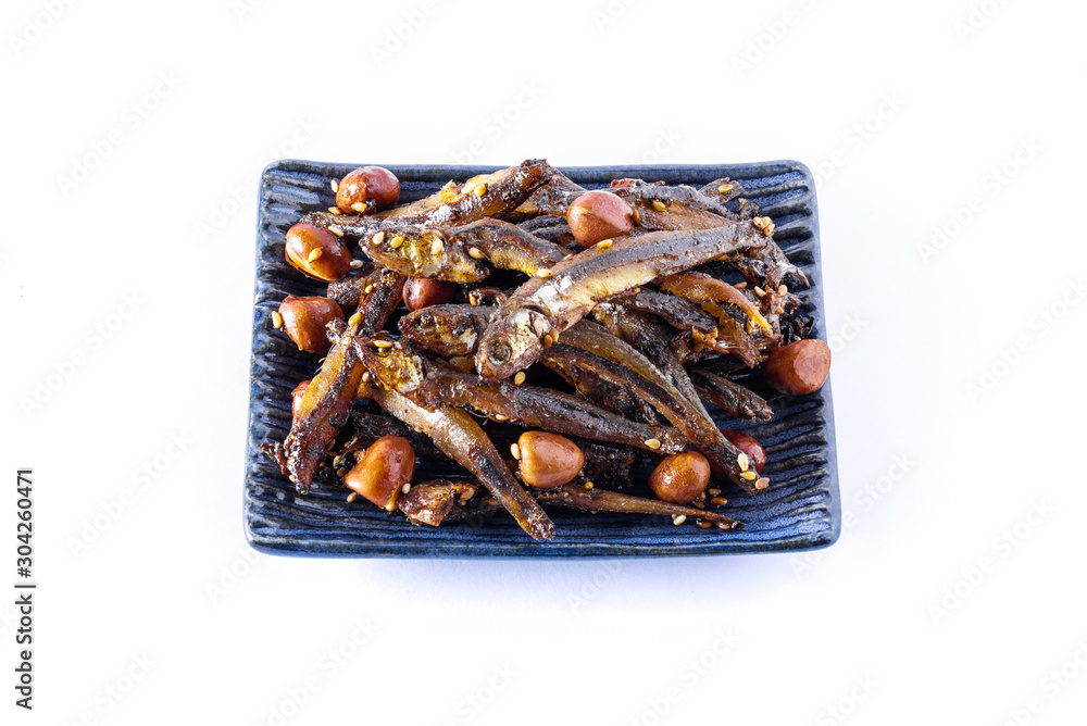 Tazukuri, candied sardines. Dried sardines lightly coated with honey, roasted sesame and peanuts. Tazukuri, candied sardines. Dried sardines lightly coated with honey, roasted sesame and peanuts.