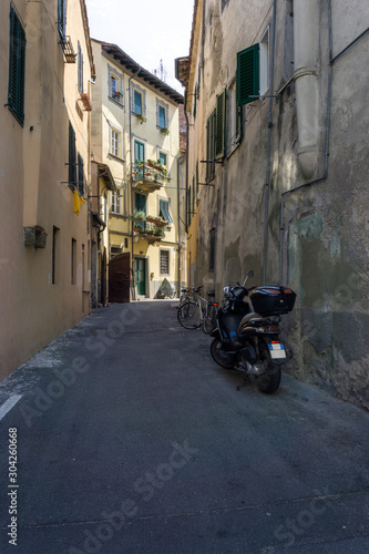 Italian street with bikes and motorcycles parked © Joyce Vincent