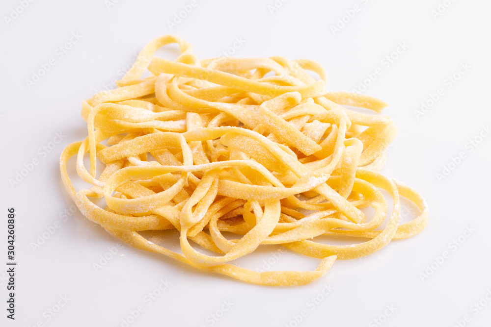 Home made pasta on white background, soft light, copy space