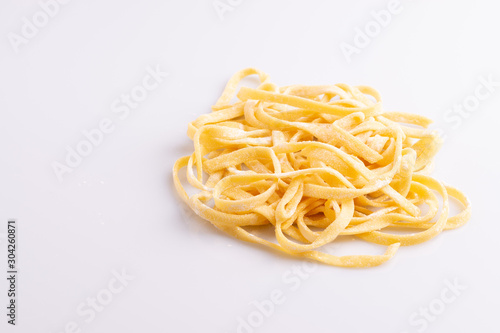 Home made pasta on white background, soft light, copy space