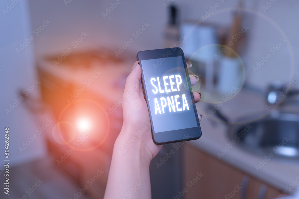 Conceptual hand writing showing Sleep Apnea. Concept meaning disorder which demonstrating repeatedly stop breathing when asleep woman using smartphone and technological devices inside the home